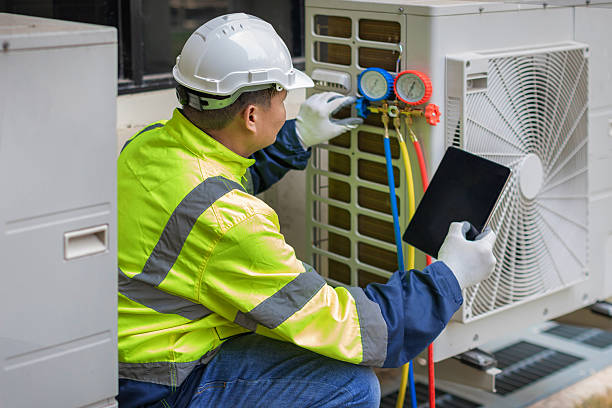 Professional Air Duct Cleaning technician working in Elgin, TX